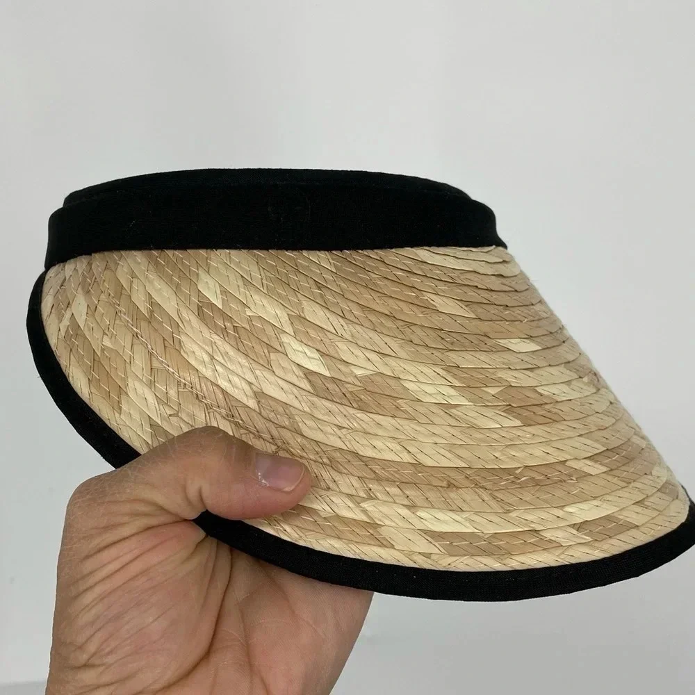 Straw visor with black trim. Terry cloth lining